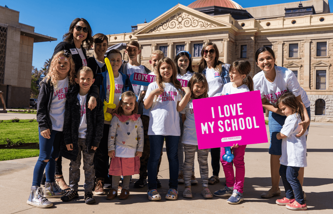 Jenny Clark (top left), shown with supporters of her Arizona nonprofit Love Your School, was appointed to the state board of education in 2022.